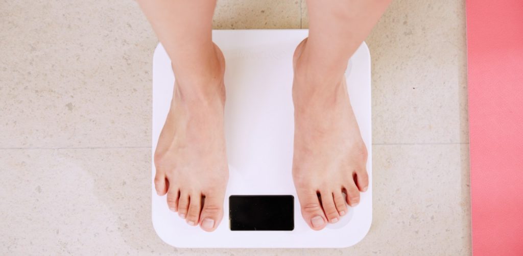 person standing on scales