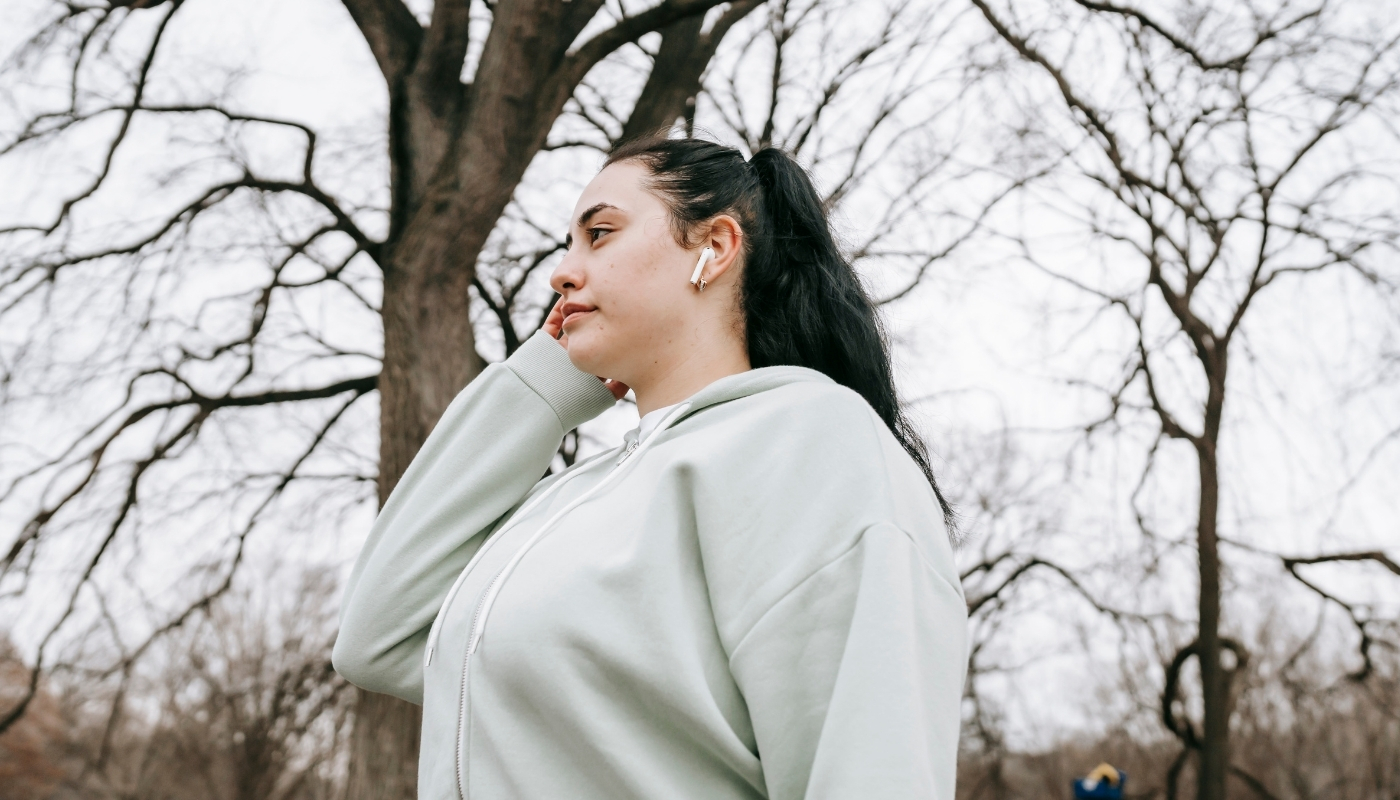 young woman walking in park